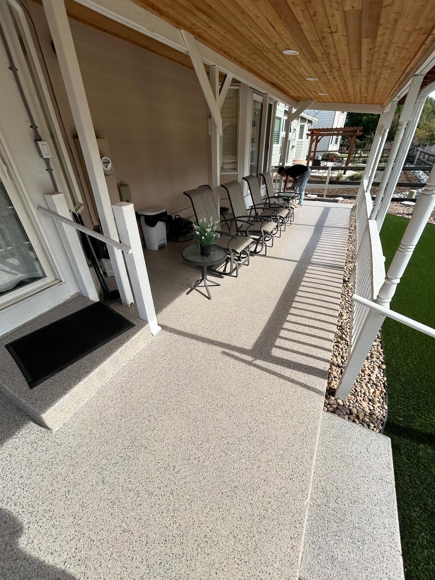 After: Flake coating on a covered front porch by SBV Concrete Coatings