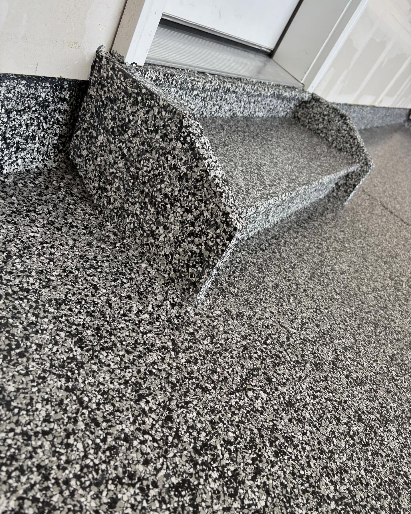 Flake epoxy garage step by SBV Concrete Coatings