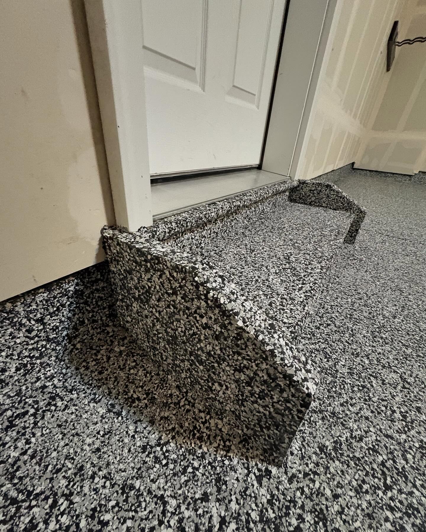Flake epoxy garage step by SBV Concrete Coatings
